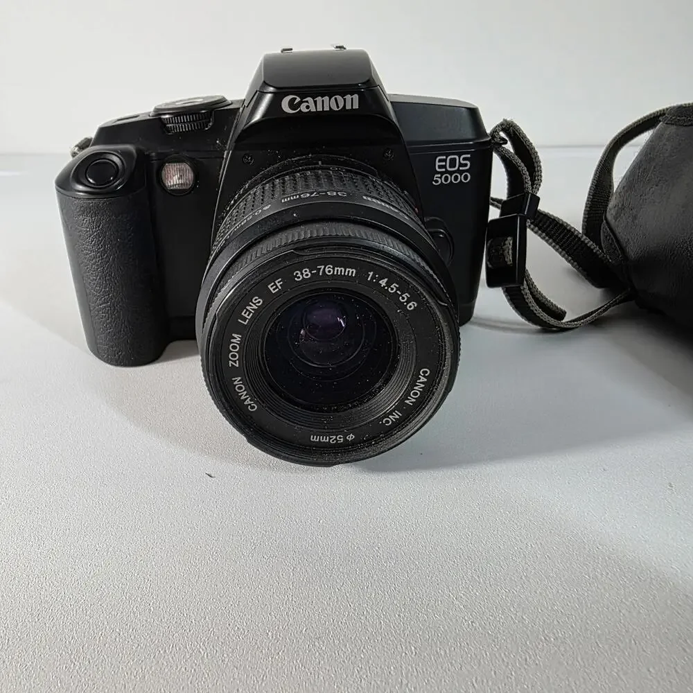 Canon EOS 5000 with 38-76mm EF zoom, UV filter, strap